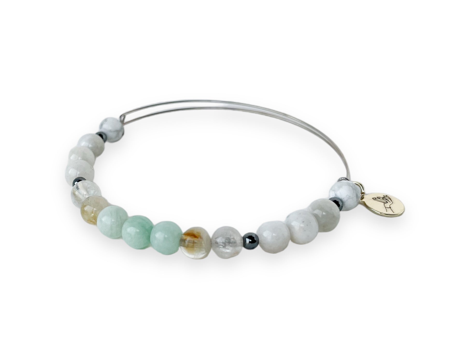 Artistic display of Gemini Bracelet, highlighting Moonstone and Howlite.