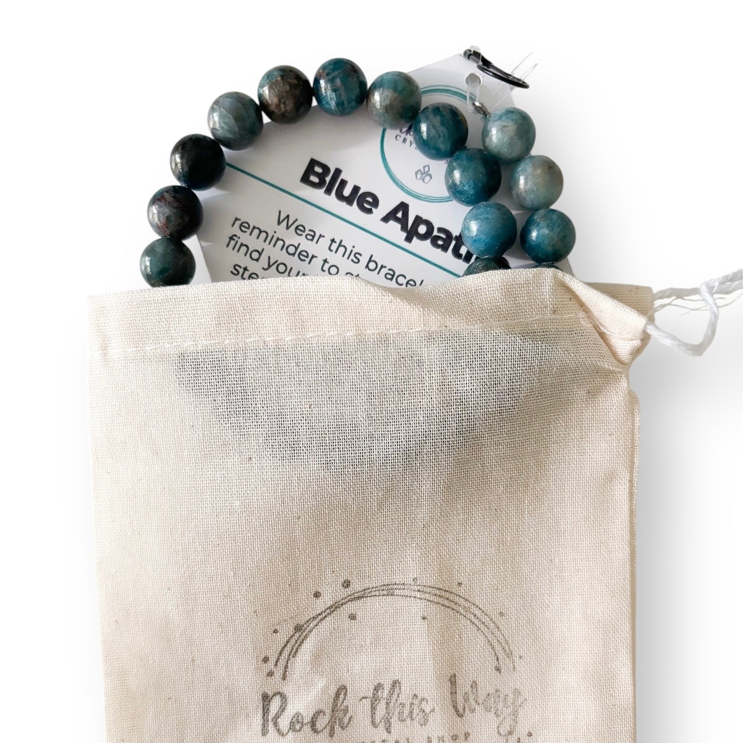 Blue apatite bracelet on a branded card over a 'Rock this Way' pouch