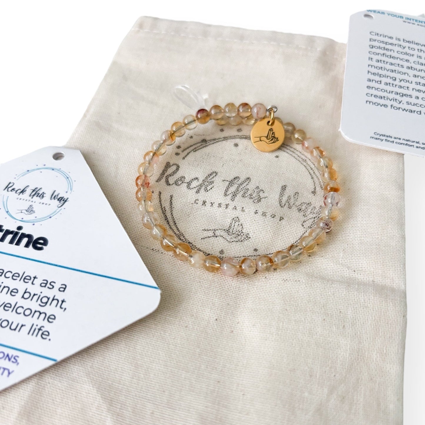 Citrine crystal bracelet with packaging on a white background ready to gift.