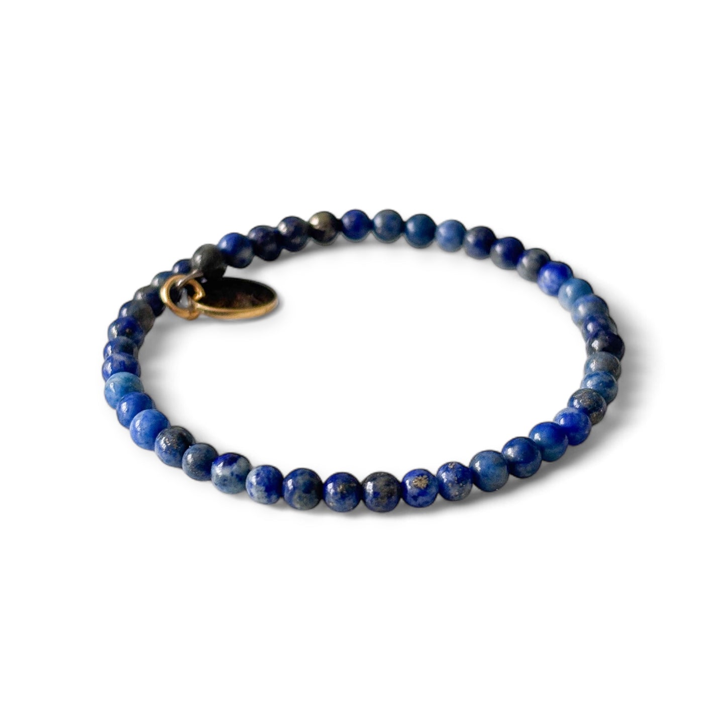 Close-up of micro-faceted Lapis Lazuli beads with subtle sparkle