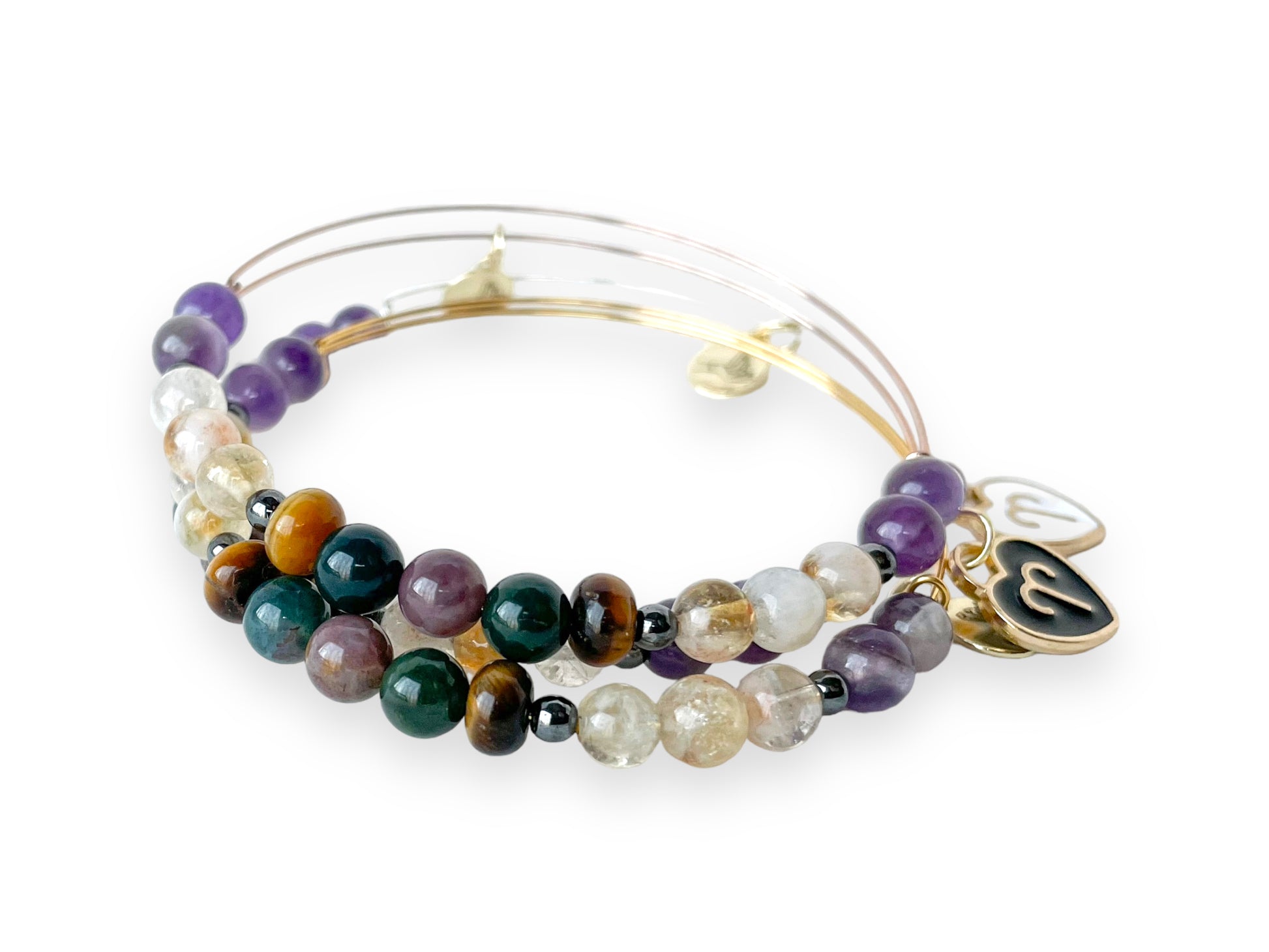 Artistic display of Aries Bracelet, highlighting Citrine and Amethyst.