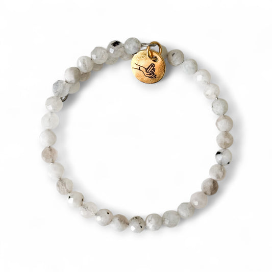 Moonstone bracelet suggesting a calming self-care ritual.