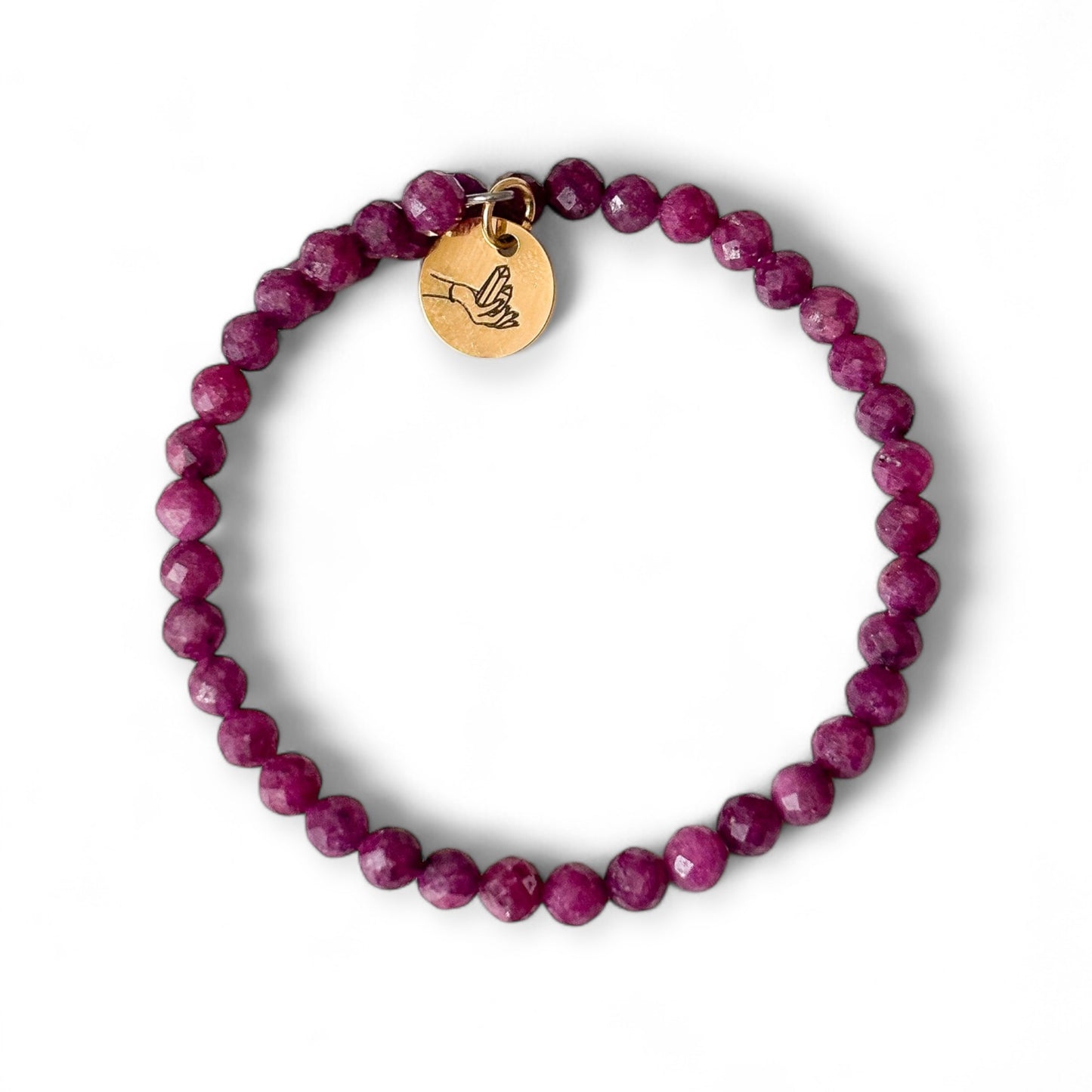 Ruby wrap bracelet with stainless steel band, flat on white background.