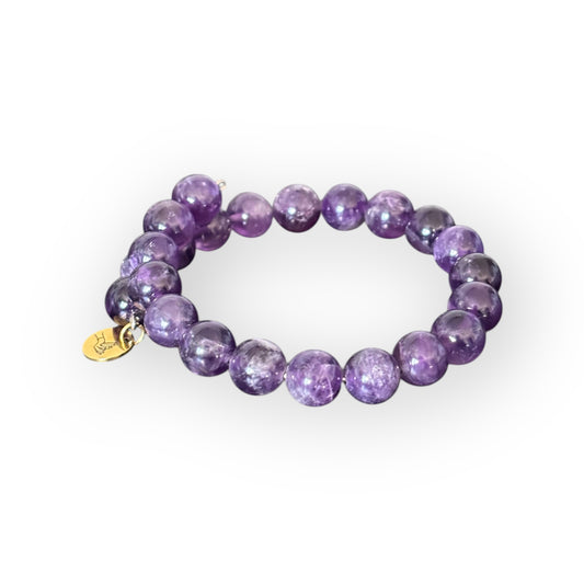 Close-up of Amethyst crystal bracelet, known for its calming and stress-relieving properties.