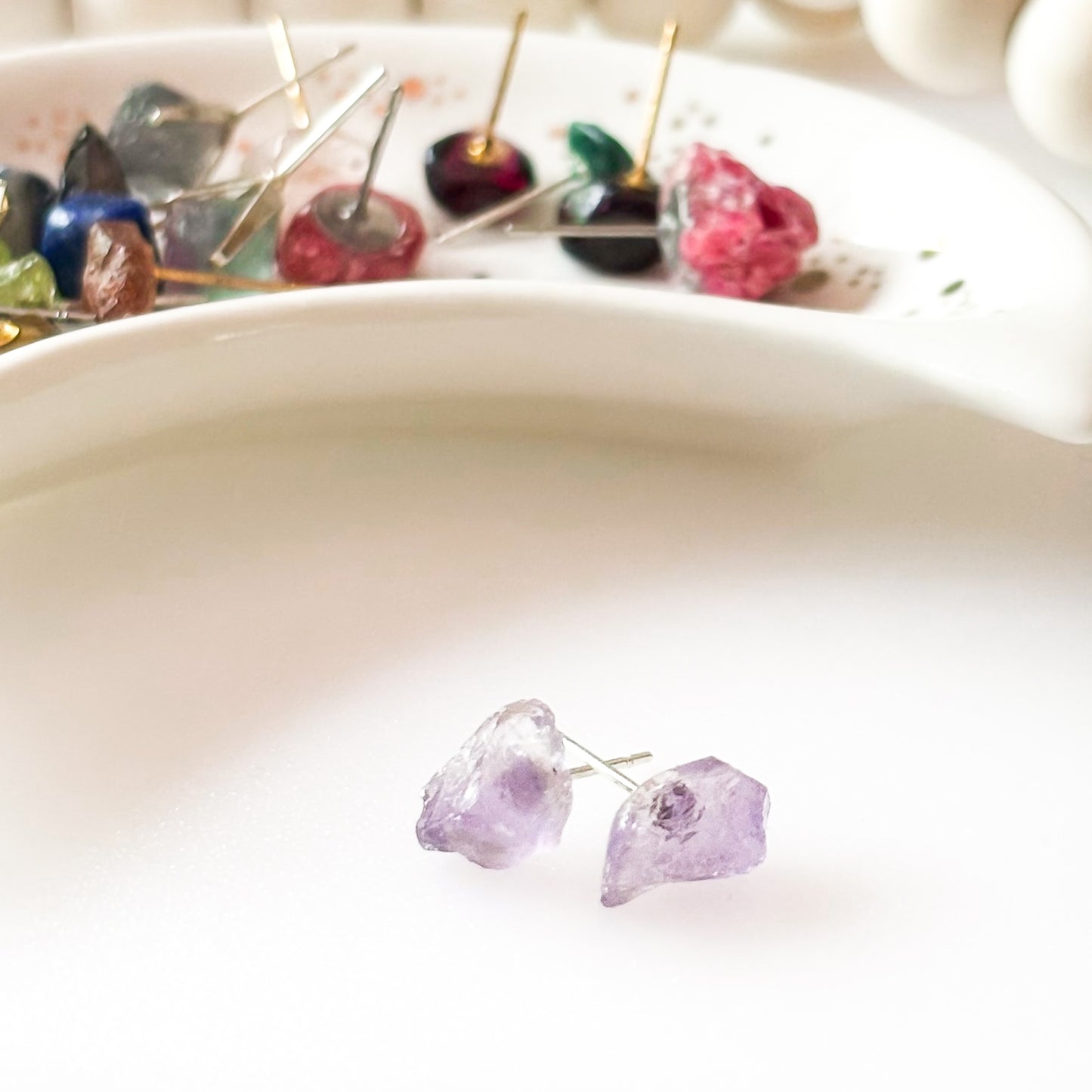 Amethyst earrings styled for February birthstone gift, rough cut crystal studs