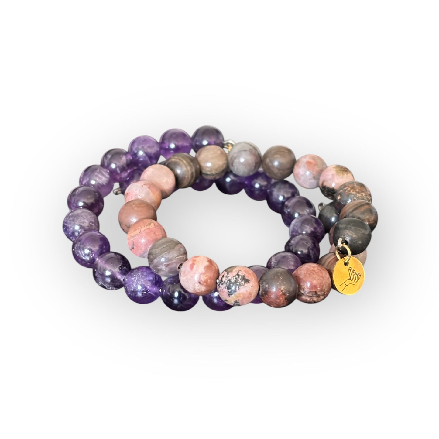 Flexible stainless steel Amethyst and Rhodonite bracelets designed for everyday wear.