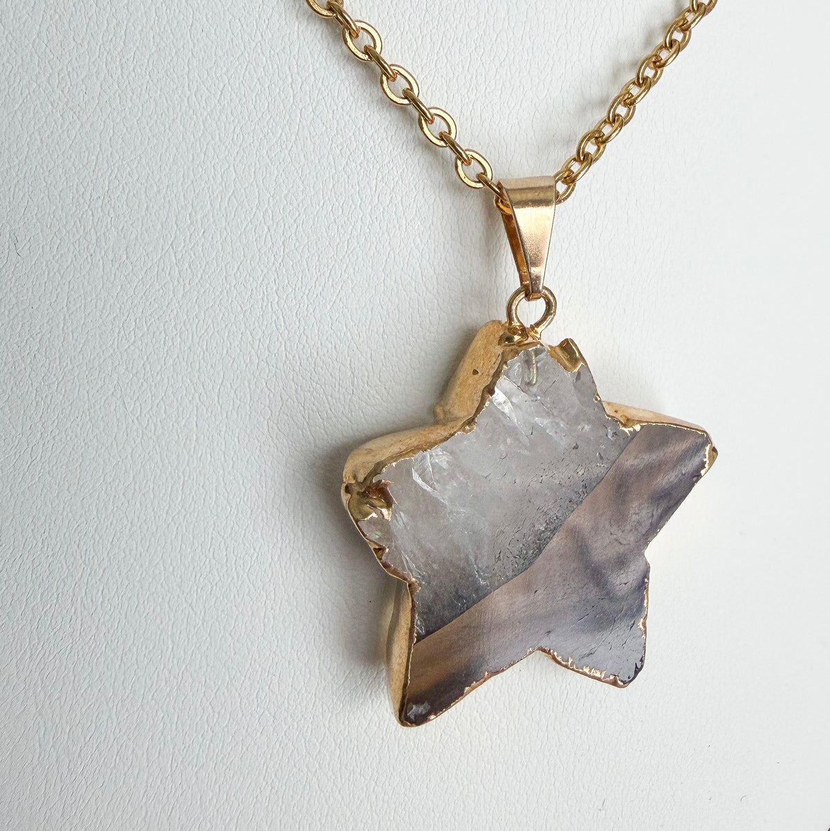 PVD gold plated stainless steel necklace with gold plated amethyst star pendant on an 18.5 inch chain.
