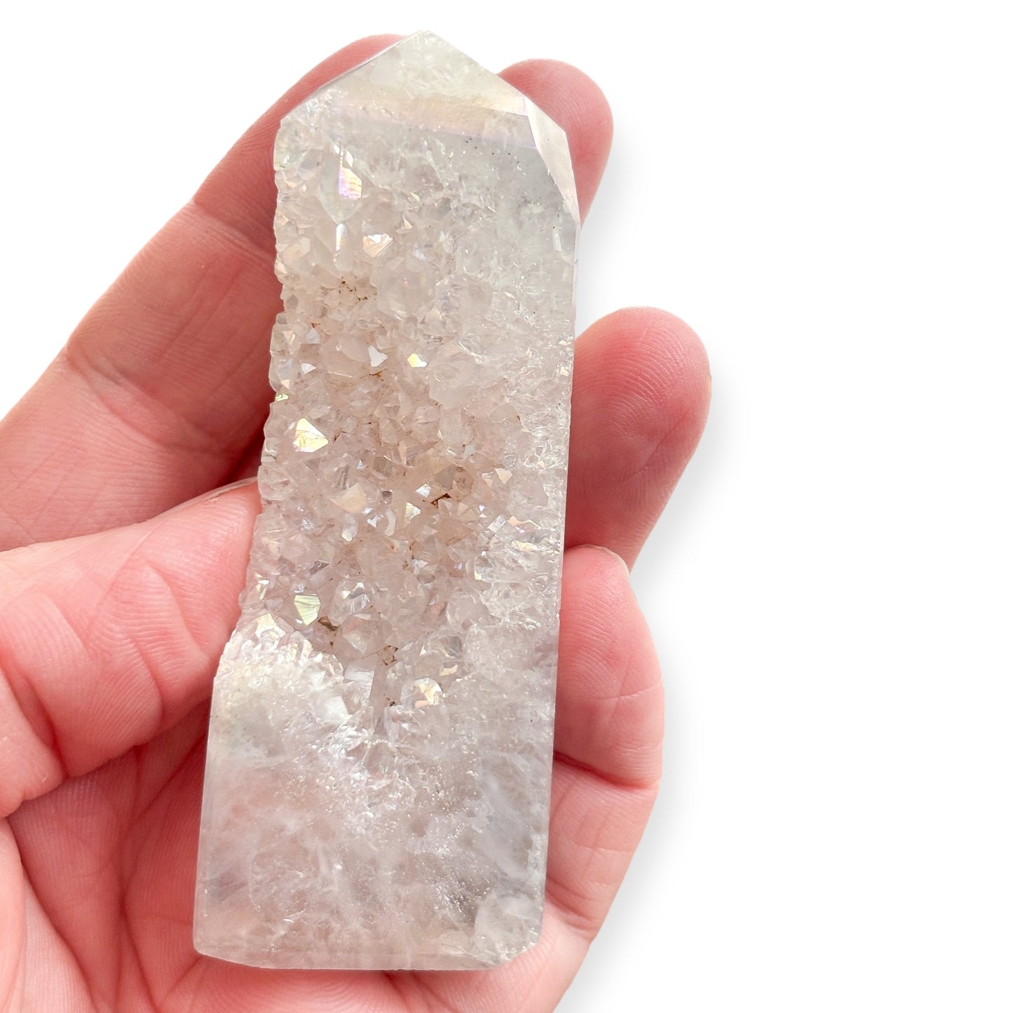 Small Angel Aura druzy tower held in hand to show size and iridescent glow