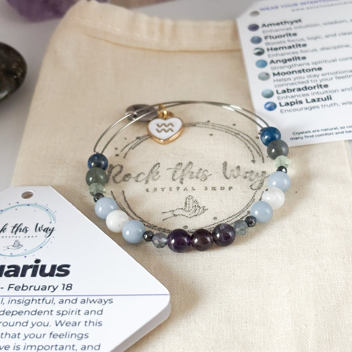 Aquarius Crystal Charm Bracelet with a white charm displayed in Rock This Way Crystal Shop packaging, ideal for gifting.