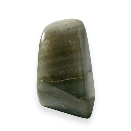 Side view of polished Aventurine crystal standing upright