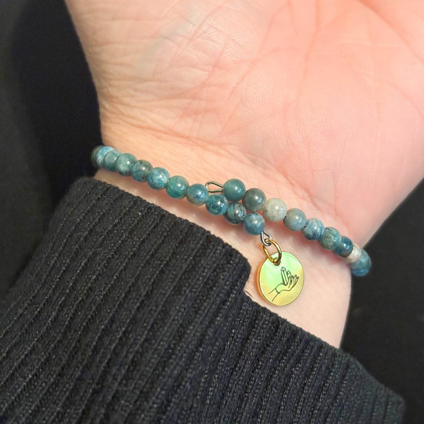 Blue Apatite bracelet wrapped on wrist with neutral, stylish outfit