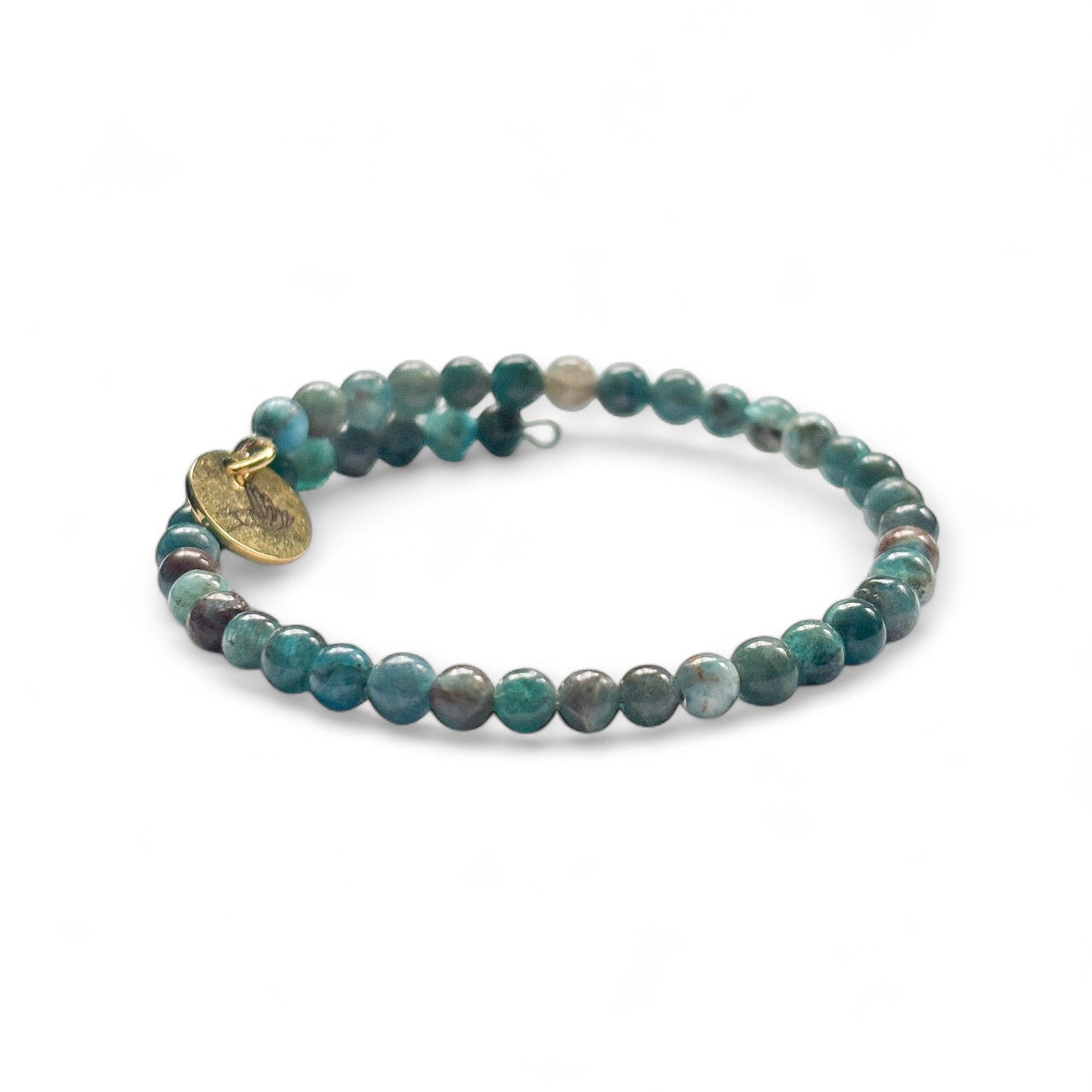 Close-up of Blue Apatite beads showing ocean-blue and teal tones with subtle sparkle