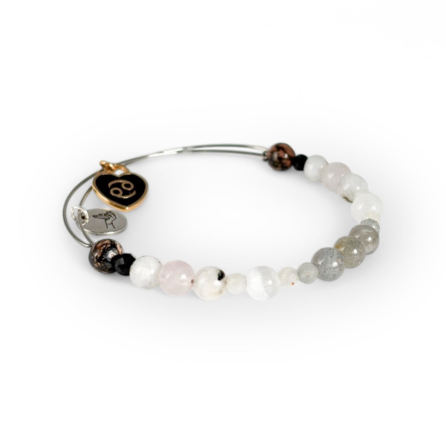 Close-up of Cancer Crystal Charm Bracelet with a black charm, highlighting its protective and nurturing gemstones.