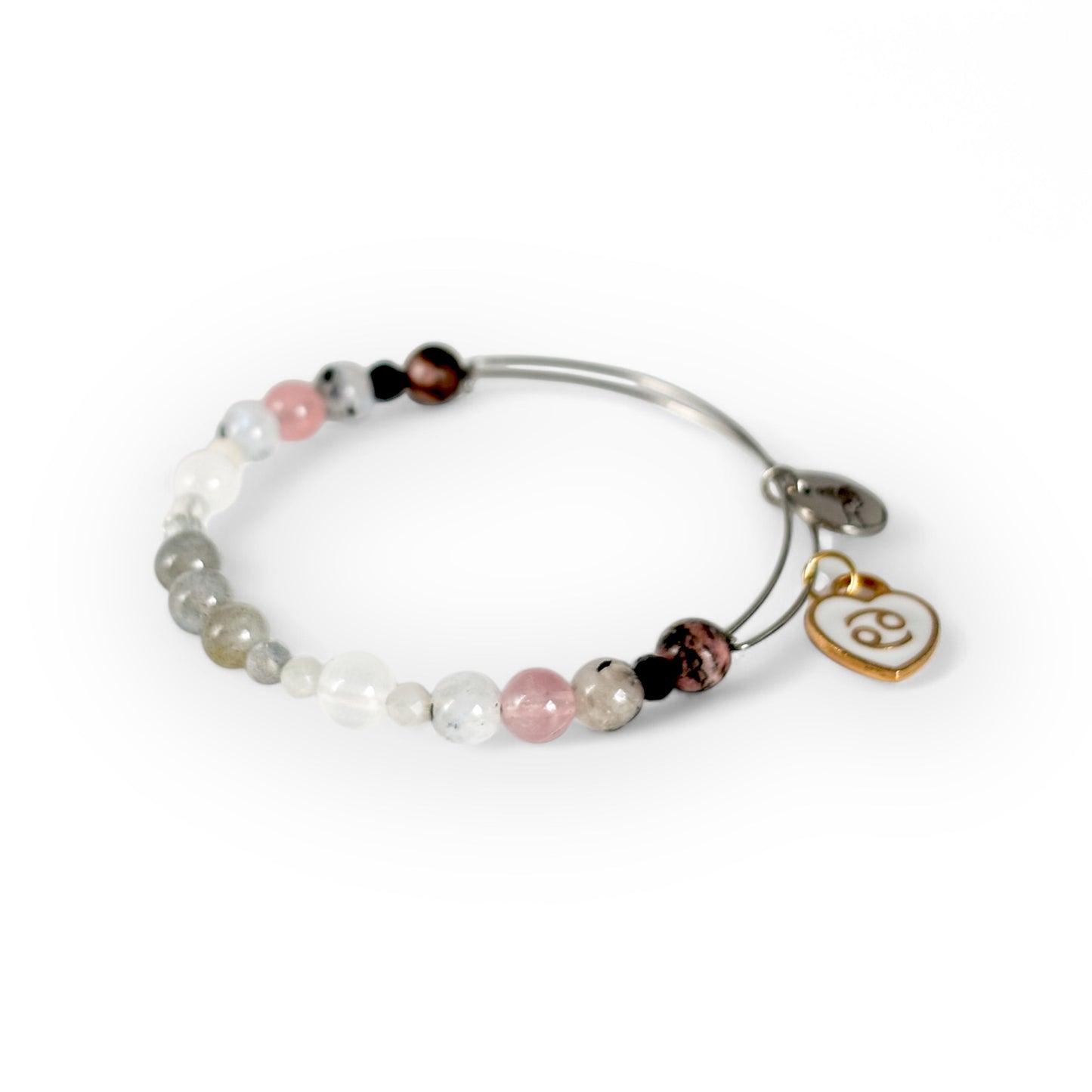 Close-up of Cancer Crystal Charm Bracelet with a white charm, showcasing its soft pink and shimmering gemstone beads.