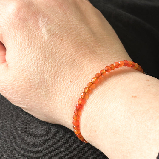 Carnelian wrap bracelet worn on wrist, showing its flexible and adjustable fit.