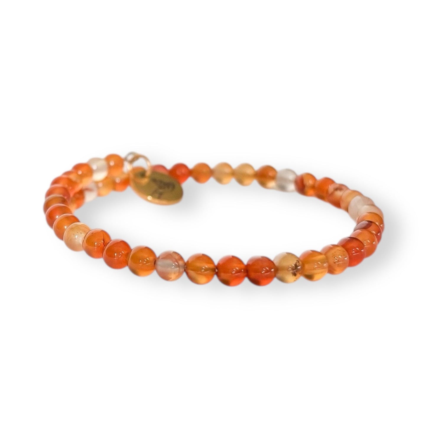 Close-up of carnelian wrap bracelet showing polished 4mm beads in rich orange-red tones.