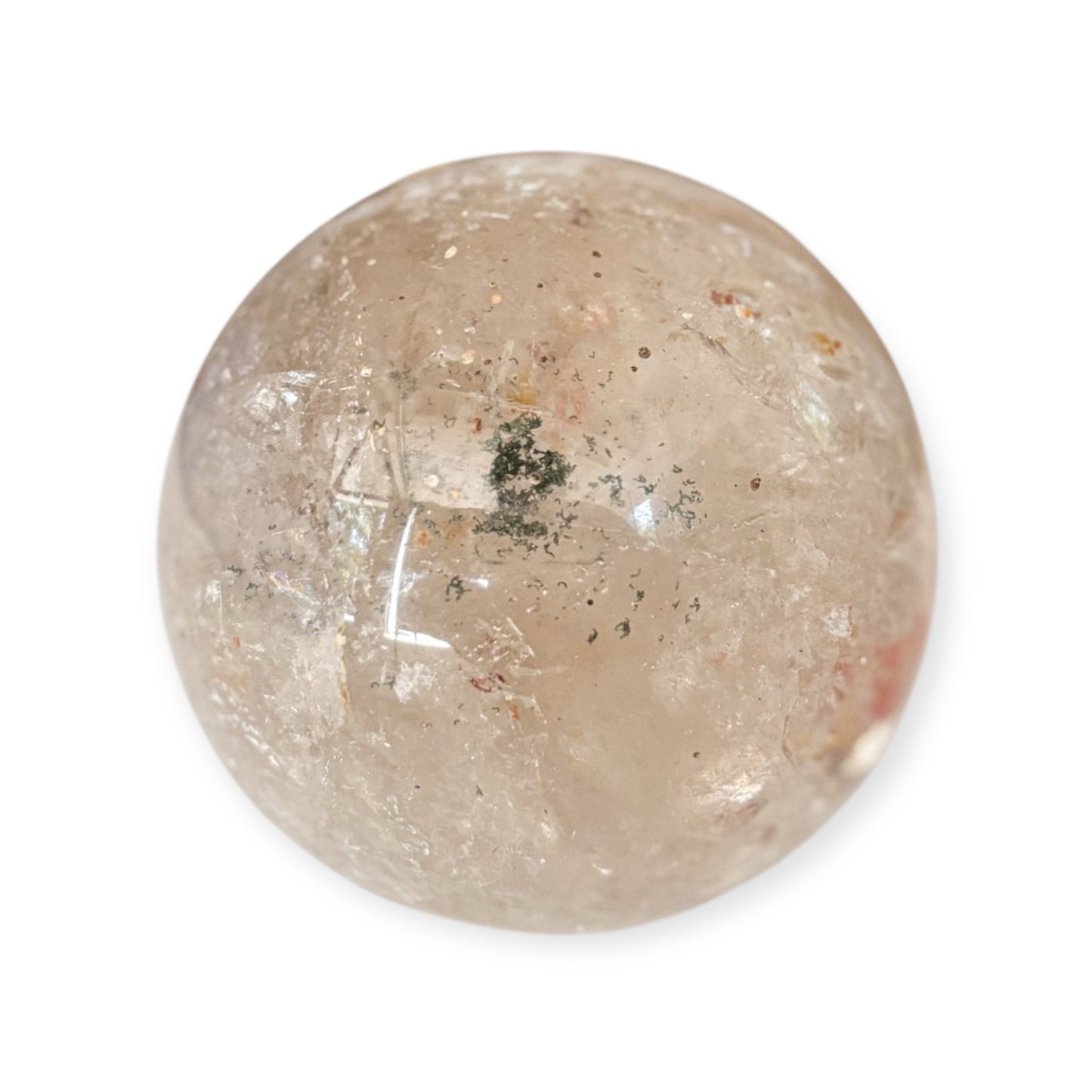 Garden Quartz sphere showing natural clarity and earth-toned minerals