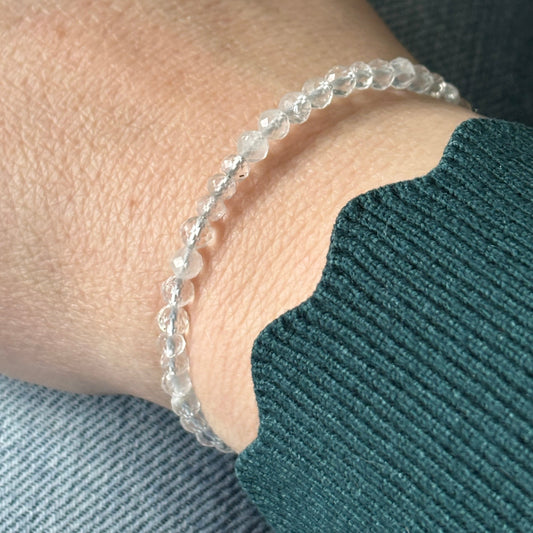 Clear Quartz wrap bracelet worn on wrist, highlighting its flexible fit and elegant simplicity.