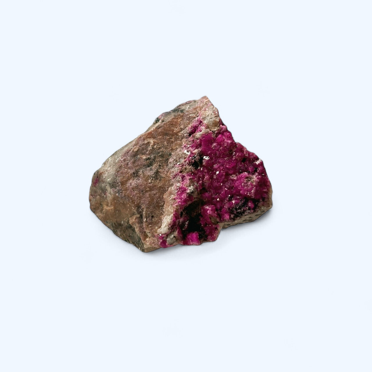 Cobalto Calcite crystal known for heart chakra healing, displayed on light background