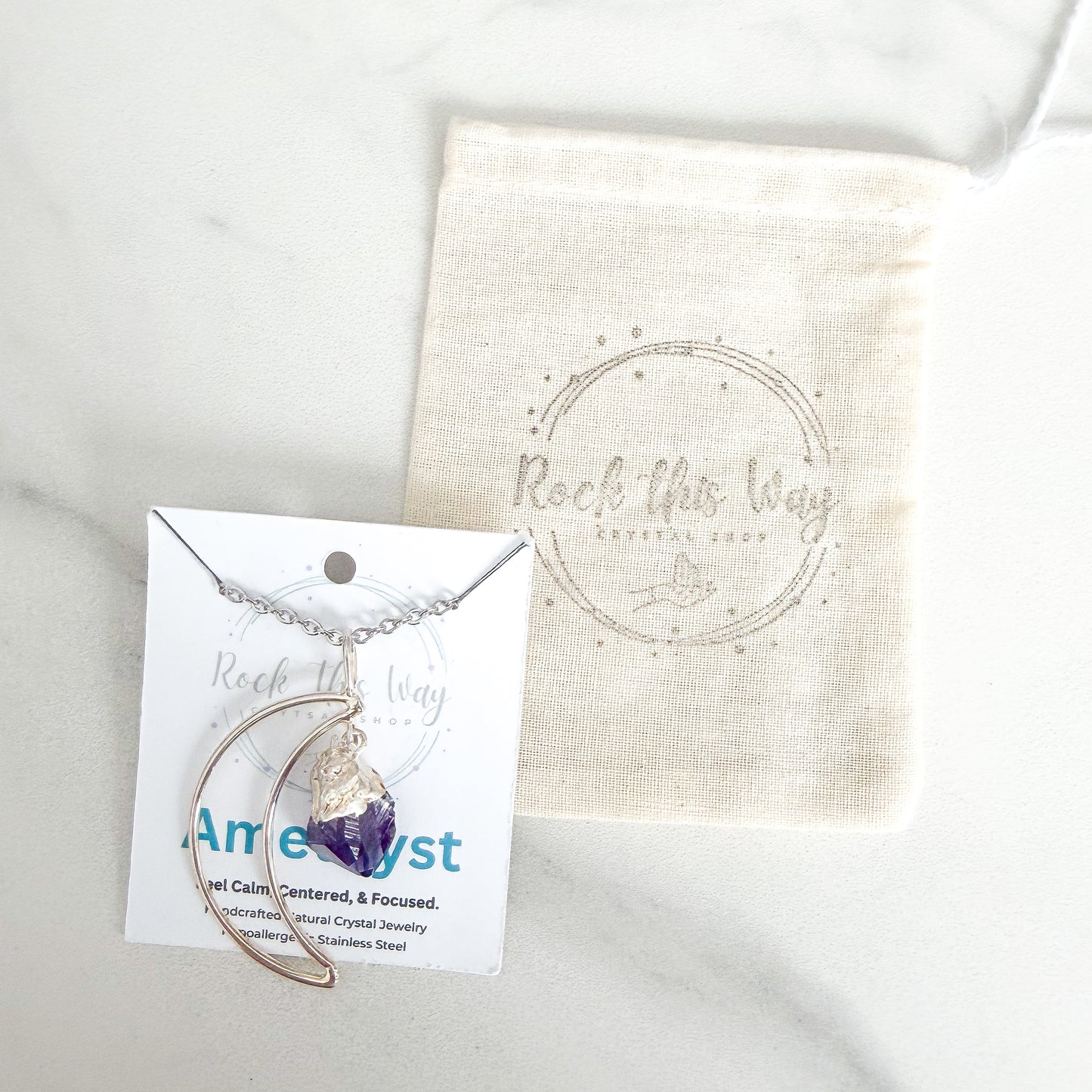 Crescent moon amethyst silver plated necklace packaged with polishing cloth from Rock This Way Crystal Shop