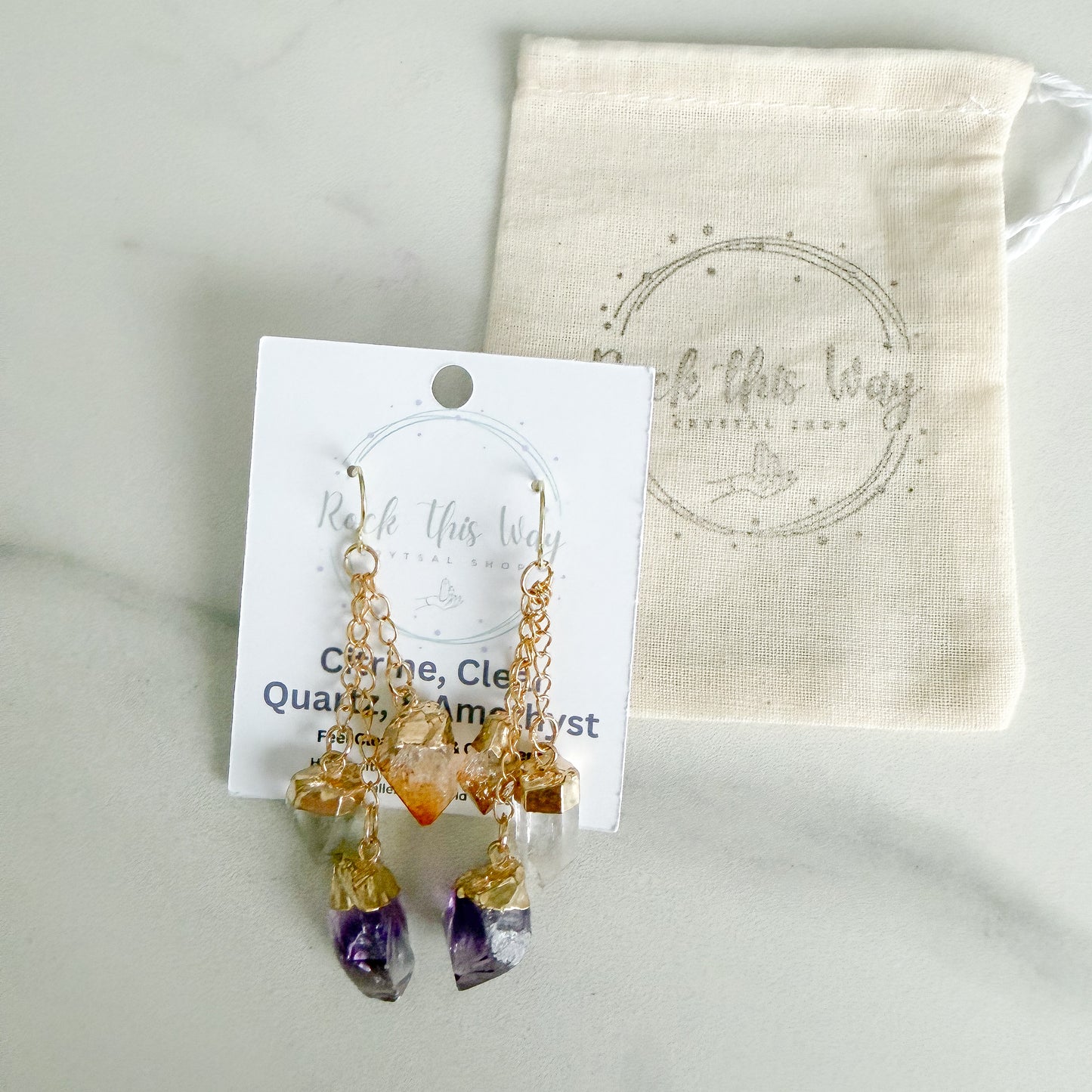 Gold plated amethyst, citrine, and clear quartz dangle earrings packaged for gifting