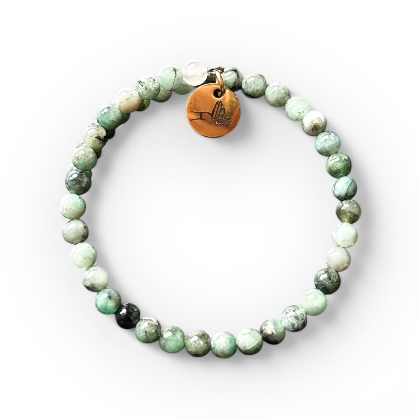 Close-up of Emerald wrap bracelet showcasing its vibrant green round beads.