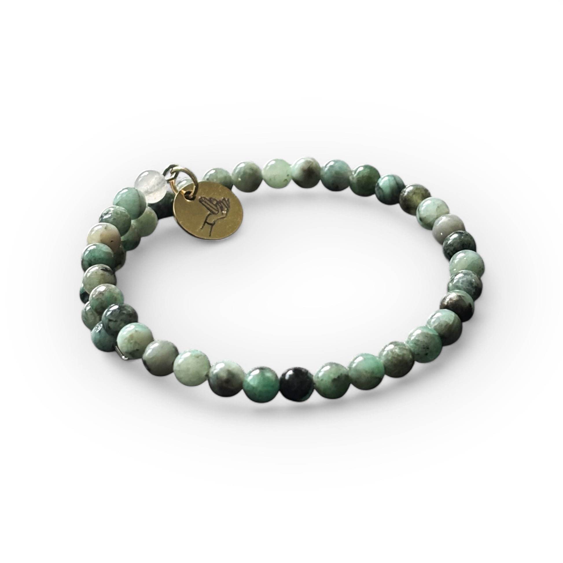Emerald wrap bracelet with 4mm polished beads, handcrafted for growth, wisdom, and abundance.