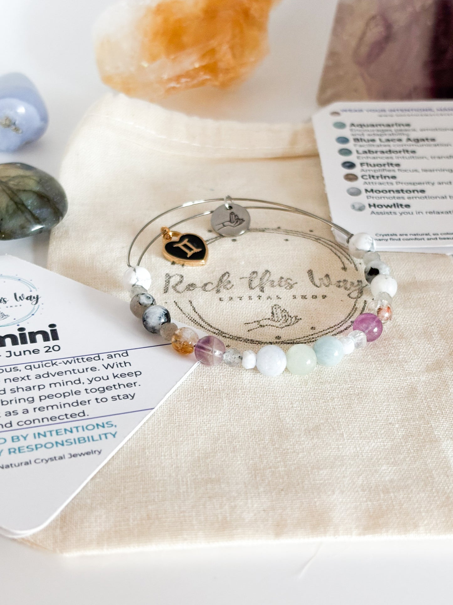Gemini Crystal Charm Bracelet with a black charm displayed in Rock This Way Crystal Shop packaging, ideal for gifting.