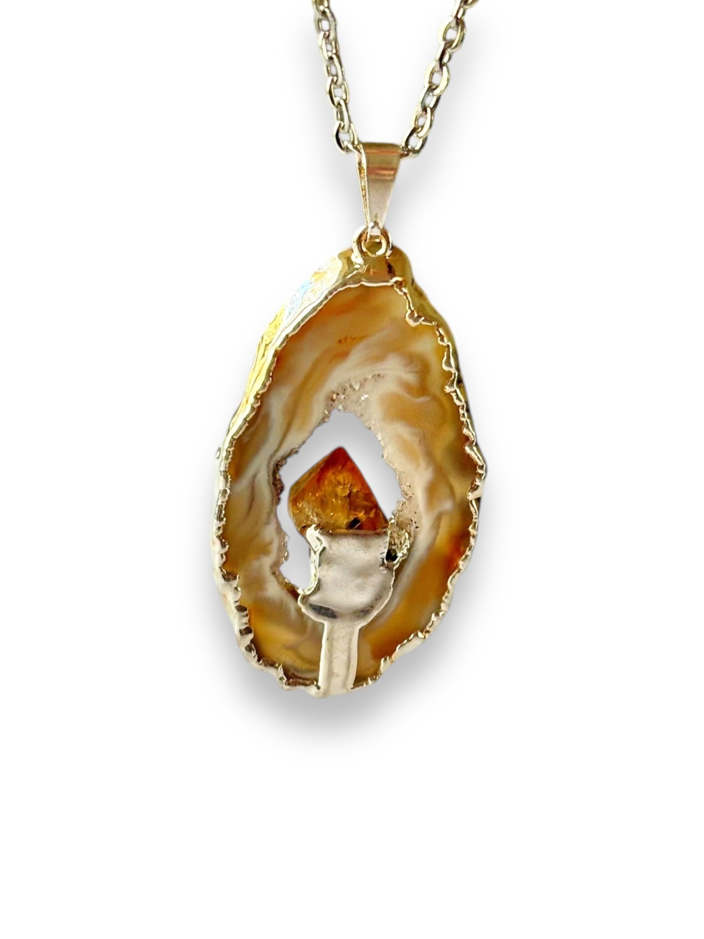 Close-up of geode with citrine necklace showing crystal texture and shine