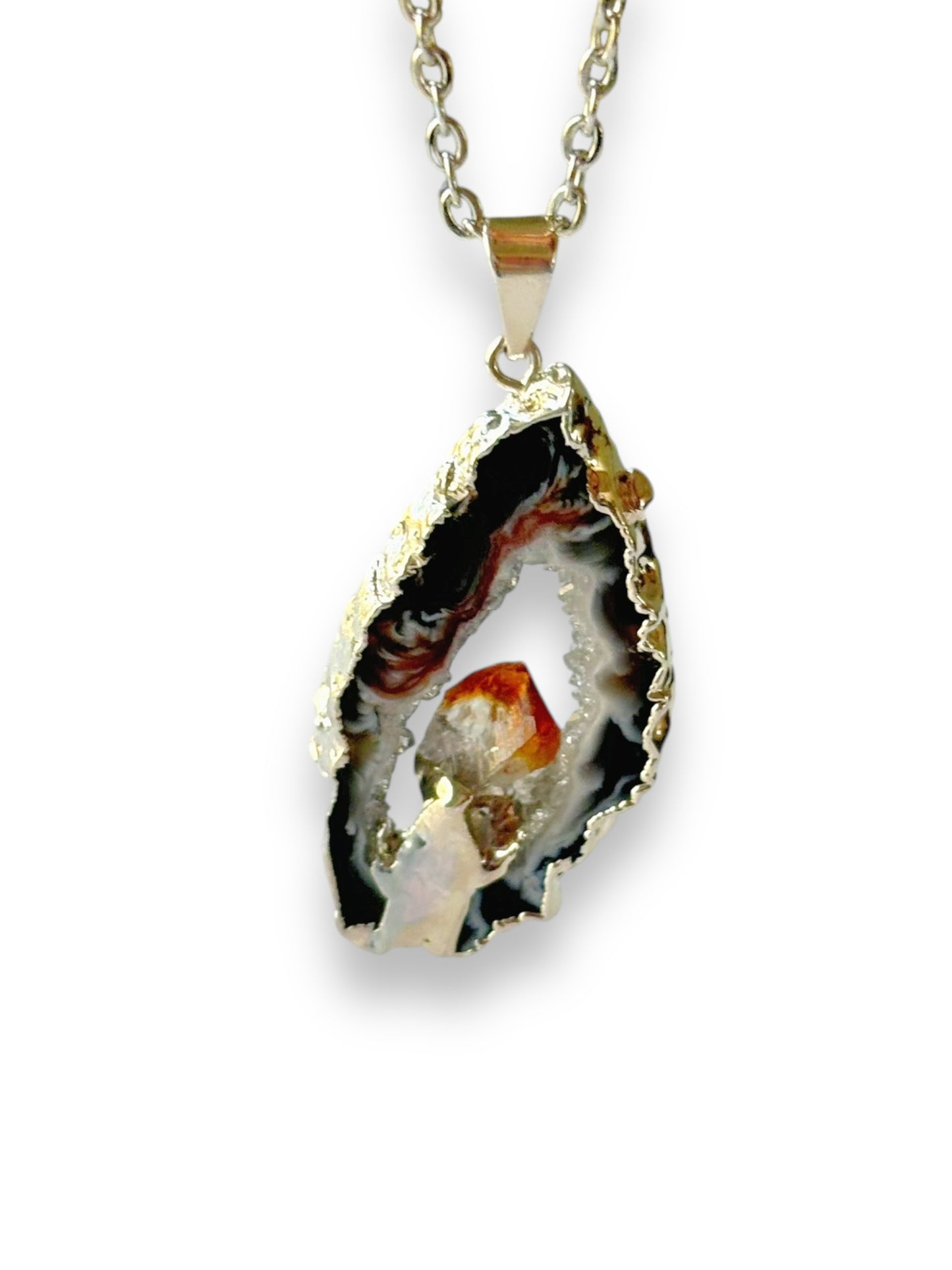 Deep gray and black agate geode pendant with fiery citrine crystal on gold-plated chain