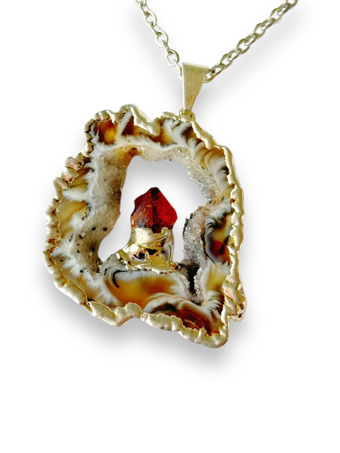 Light agate geode necklace with soft tan and cream banding and golden-orange citrine point
