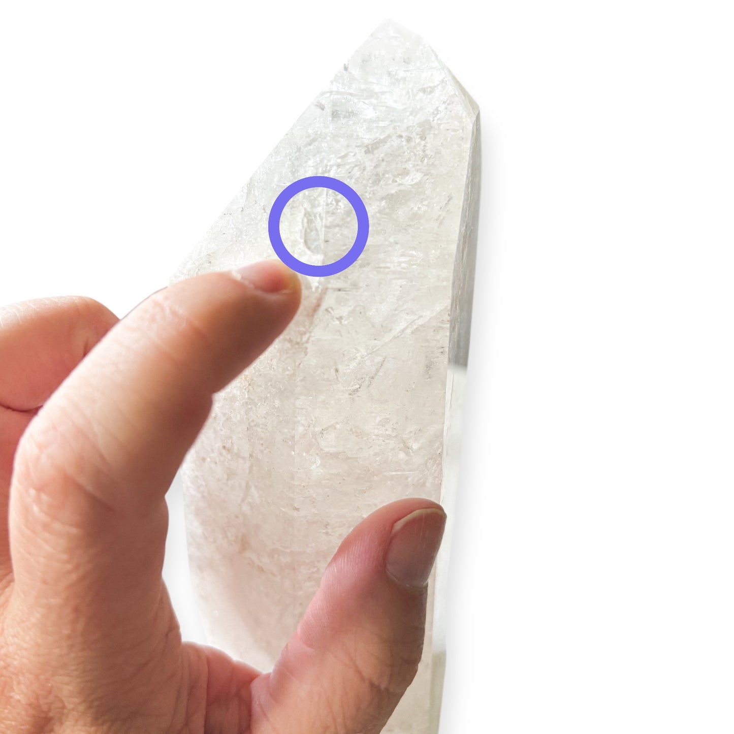 Detail of small chip on the point of Girasol Quartz Tower, circled for visibility.