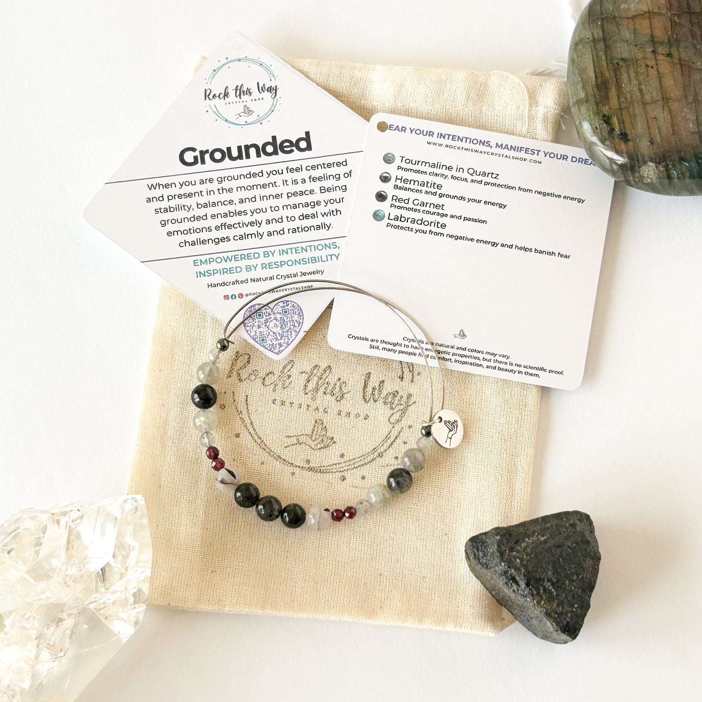 Grounded crystal bracelet styled with neutral outfit, showing bracelet stack and natural colors