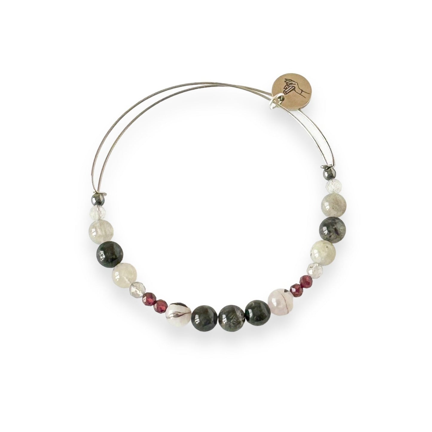 Grounded Crystal Bracelet bangle with garnet, labradorite, and hematite on a stainless steel band
