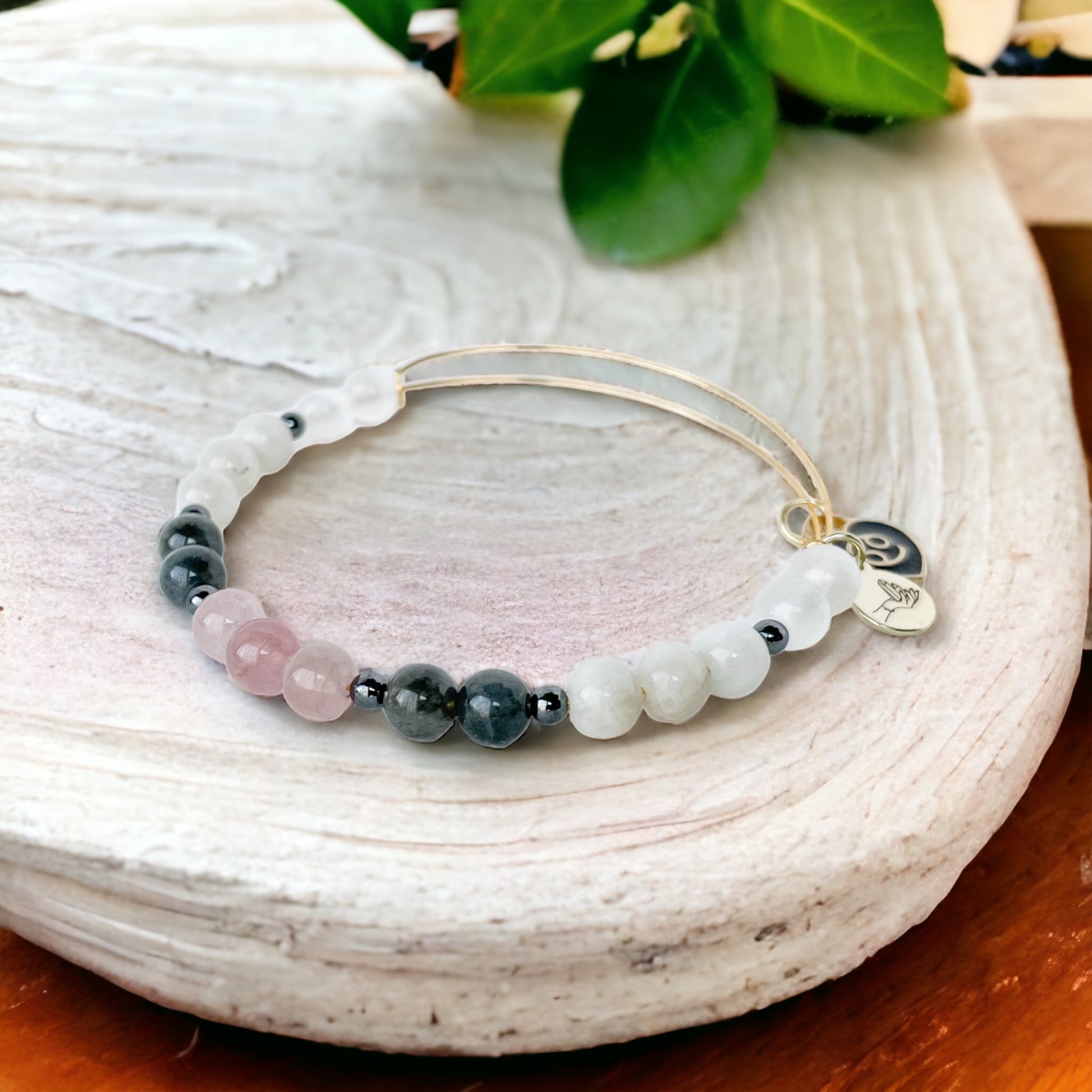 Cancer Bracelet against a serene backdrop, reinforcing its nurturing nature.