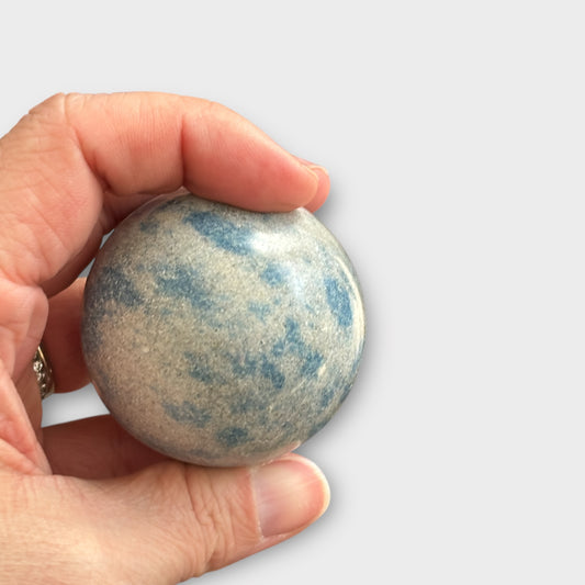 K2 Jasper Sphere held in hand showing blue azurite orbs