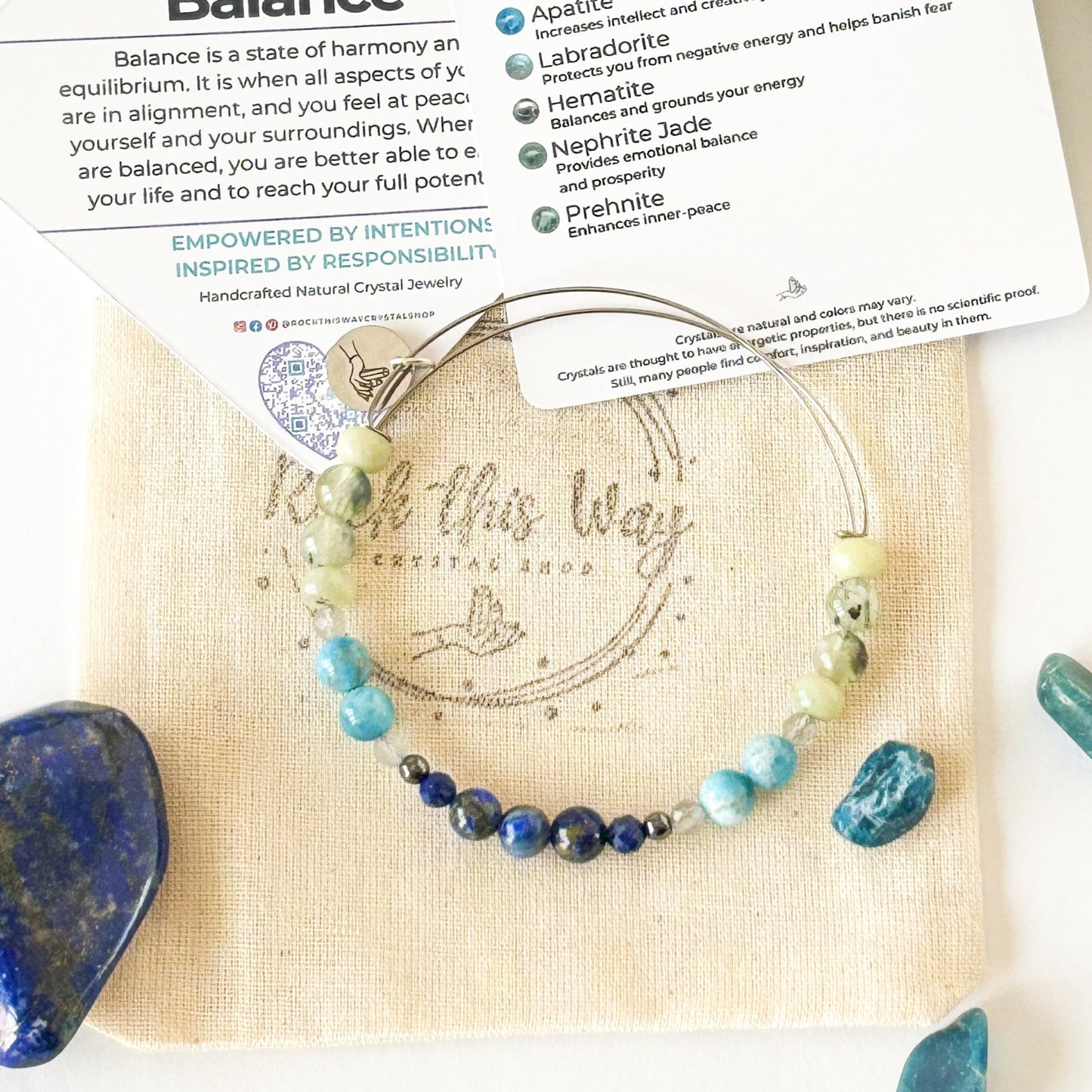 Bracelet laid flat showing green, blue, and yellow crystal flow