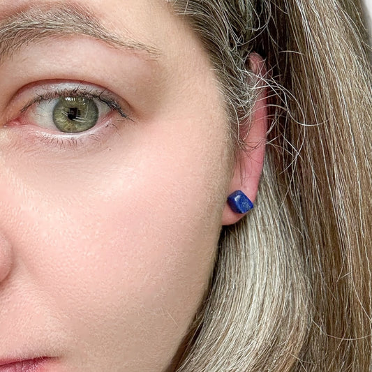 Front view of polished Lapis Lazuli stud earrings on stainless steel posts
