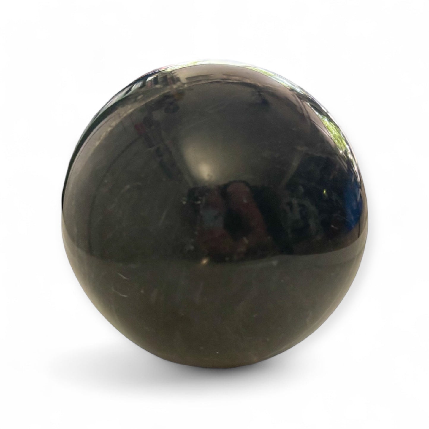 Closeup of natural white veining in large black marble sphere