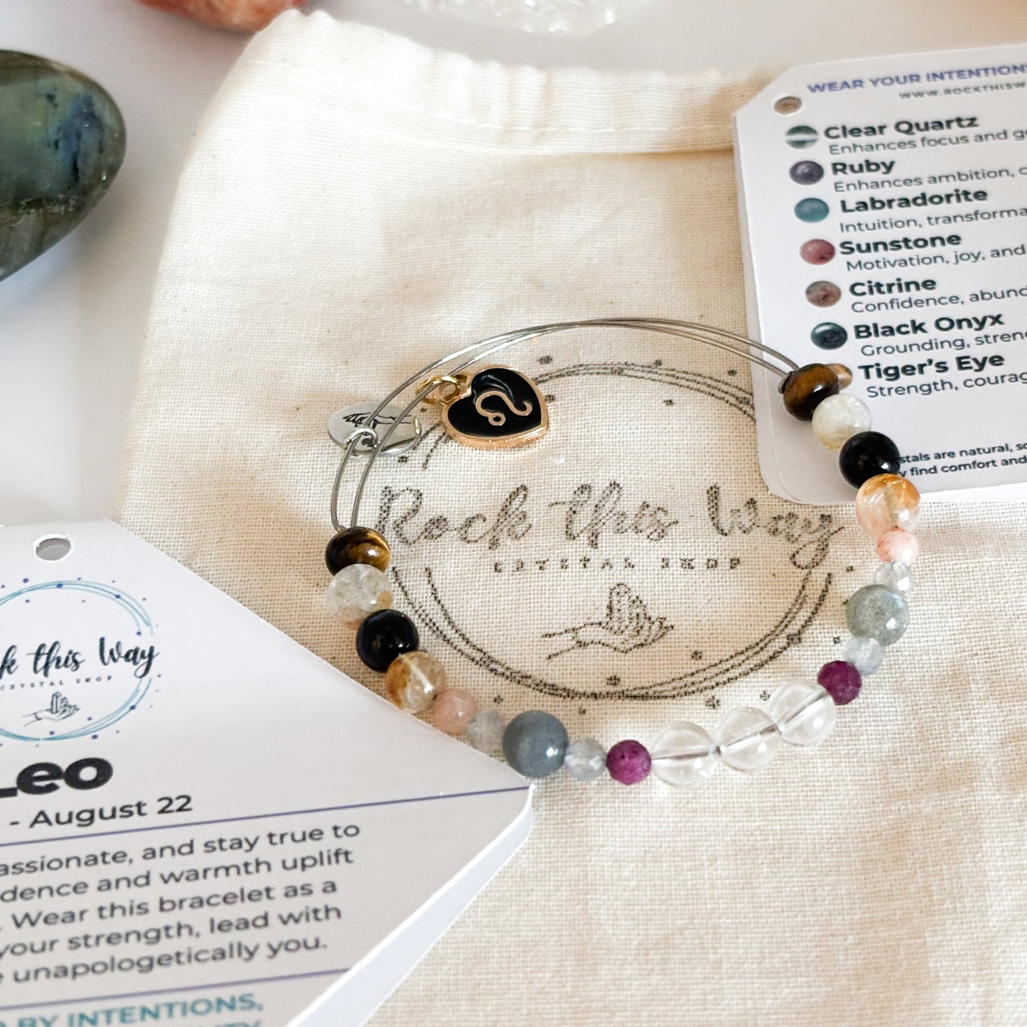 Leo Crystal Charm Bracelet with a black charm displayed in Rock This Way Crystal Shop packaging, perfect for gifting.