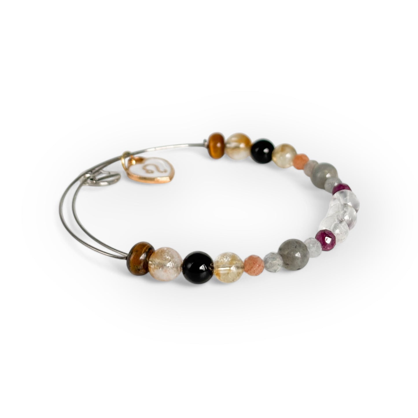 Close-up of Leo Crystal Charm Bracelet with a white charm, showcasing its bold and radiant gemstone beads.