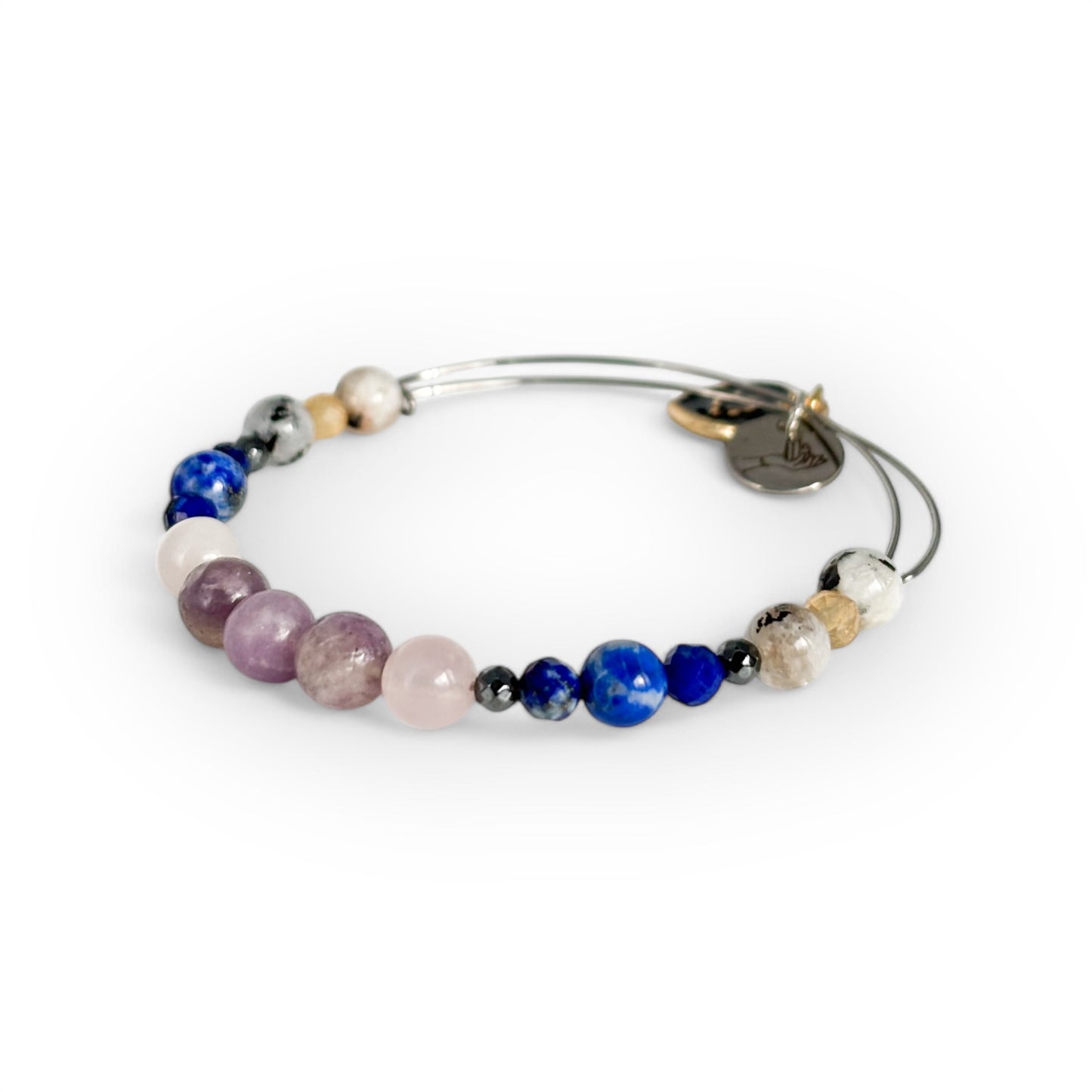 Close-up of Libra Crystal Charm Bracelet with a black charm, highlighting its soothing and harmonious gemstone combination.
