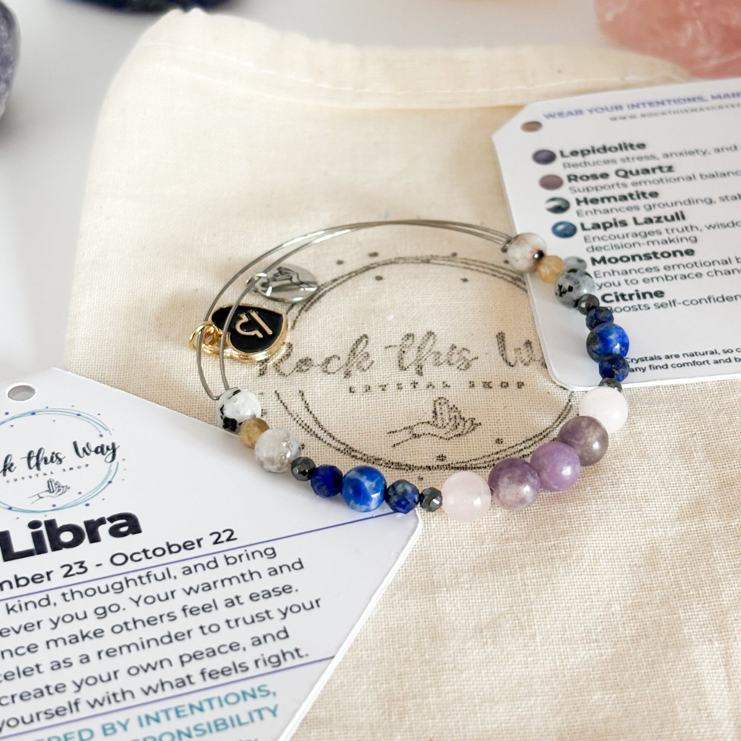 Libra Crystal Charm Bracelet with a black charm displayed in Rock This Way Crystal Shop packaging, ideal for gifting.