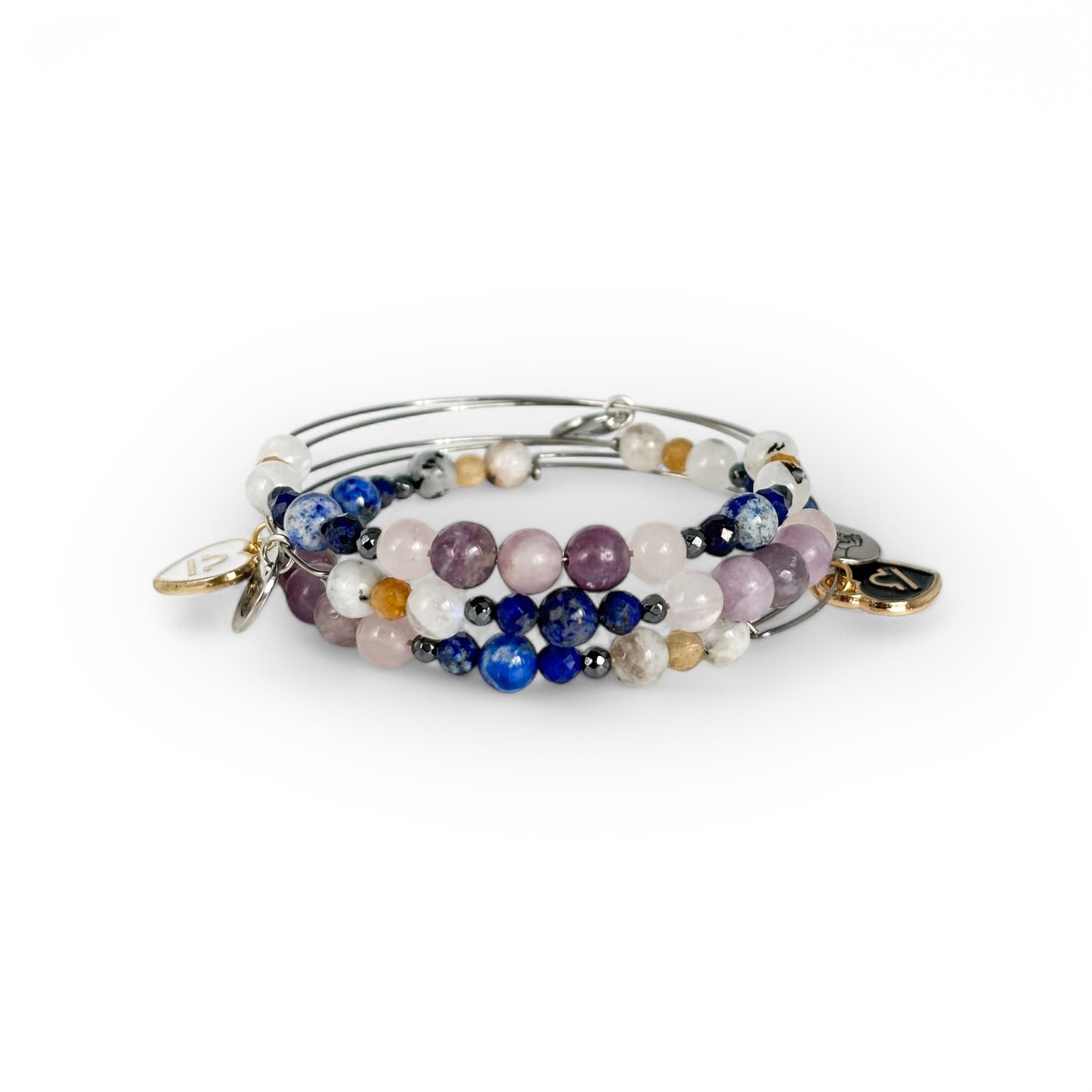 Libra Crystal Charm Bracelet with a black charm stacked with other bracelets for a refined, balanced style.
