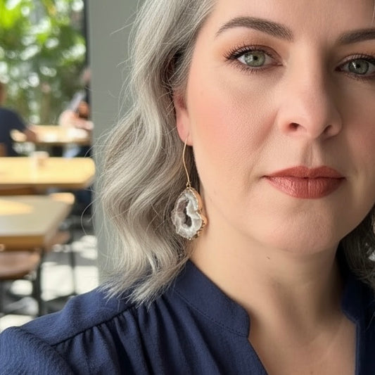 Light agate slice geode earrings with gold filled hooks worn on model, natural neutral crystal drop earrings