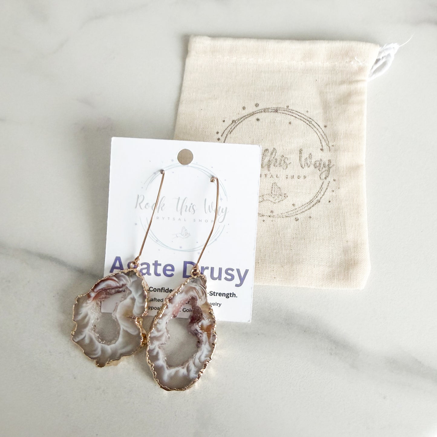 Light agate slice geode earrings packaged for gifting in Rock This Way Crystal Shop jewelry packaging