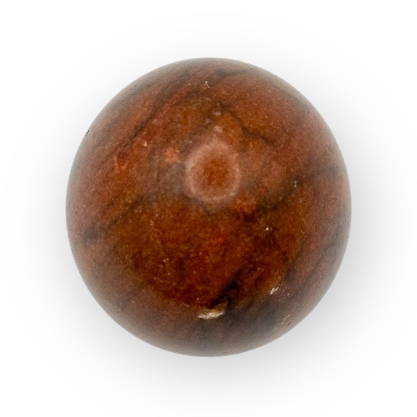 Close-up of Mahogany Obsidian crystal egg showing rich brown and black marbled texture