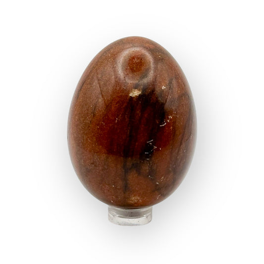 Medium Mahogany Obsidian egg on display stand, highlighting protective crystal energy
