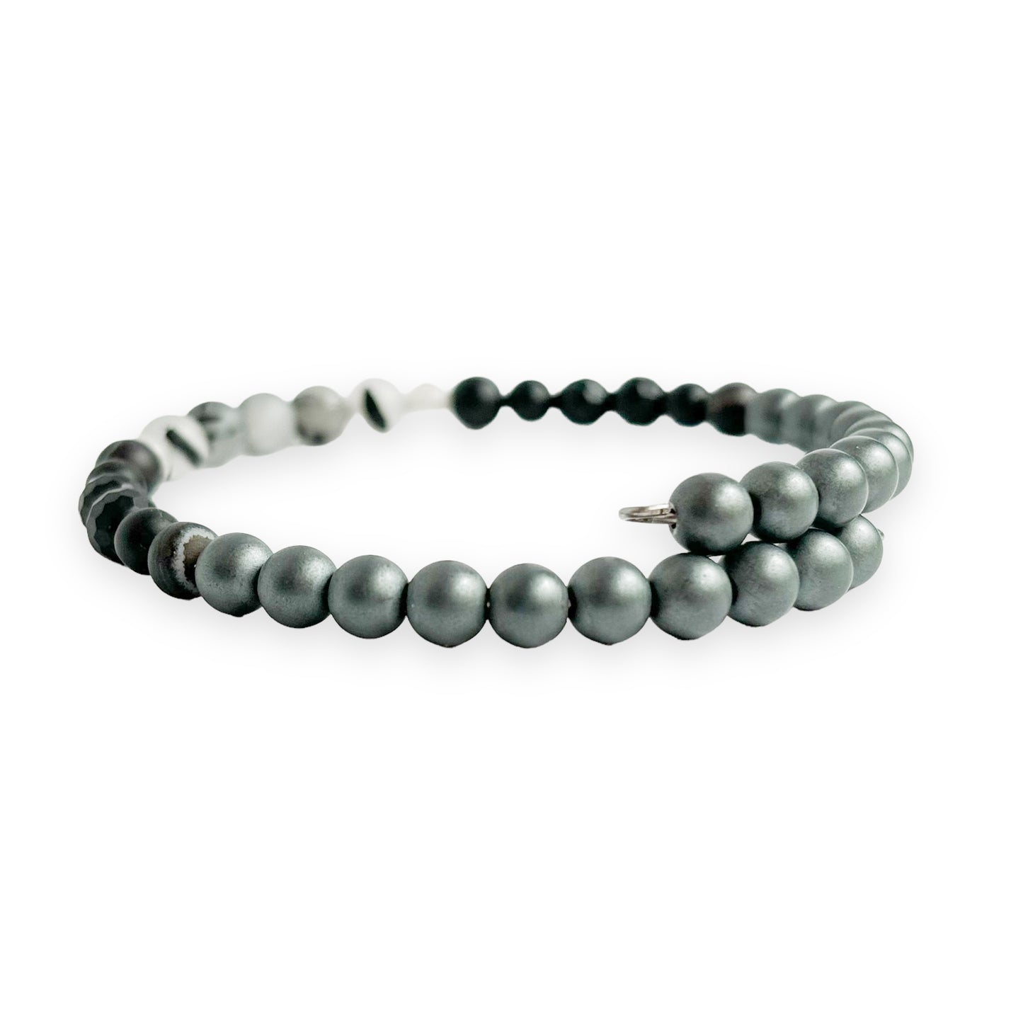 Side view of unisex strength bracelet on stainless steel band