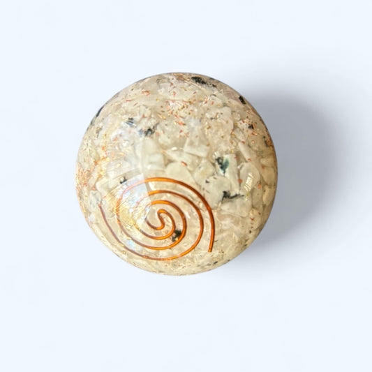 Close-up of Moonstone Orgone Sphere showing crystal chips and copper coil